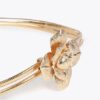 CINTURA ELASTICIZZATA IN METALLO CON FIORE