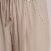 PANTALONE CON DETTAGLIO BORCHIE